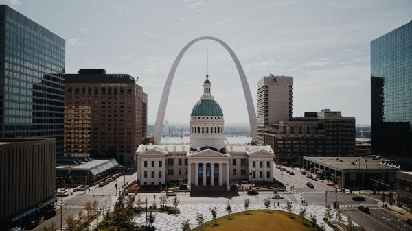 Photo of Gateway Arch and St Louis buildings. By Brittney Butler on Unsplash.